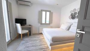 Postel nebo postele na pokoji v ubytování Psarou Summer Villas