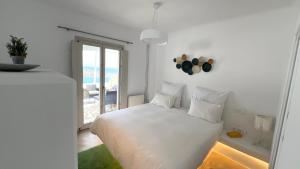 Postel nebo postele na pokoji v ubytování Psarou Summer Villas + 29 fotografií