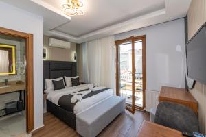 Postel nebo postele na pokoji v ubytování T-Square Residence