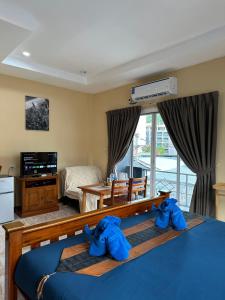 Postel nebo postele na pokoji v ubytování BT hotel Kata Beach