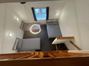 a room with two beds on the wall and a window at Bushmills Hostel in Bushmills
