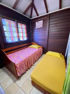 En eller flere senge i et værelse på Instant nature