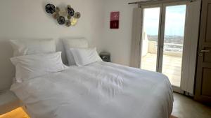 Postel nebo postele na pokoji v ubytování Psarou Summer Villas