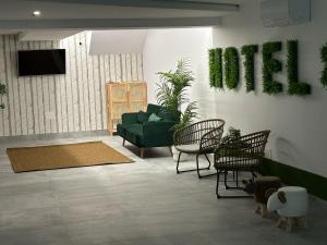 TV a/nebo společenská místnost v ubytování Hotel Playa de Sardiñeiro