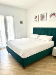 Ένα ή περισσότερα κρεβάτια σε δωμάτιο στο Casa Vacanze Tellus