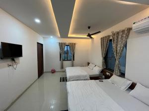 Hotel Shri Raghuvansh客房内的一张或多张床位