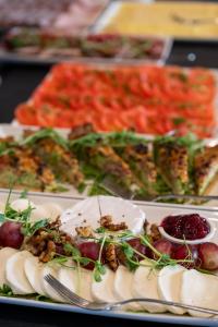 a plate of food with appetizers on a table at Hotel Atrium in Krakow +79 photos