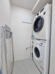 a washer and dryer in a laundry room at Shin-Nonhyeon Hideout in Seoul