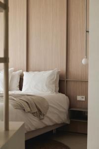 Postel nebo postele na pokoji v ubytování Enso District Hotel