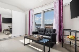 a living room with a couch and a table at Adults only Guesthouse Villa Samantha by Irundo in Rovinj