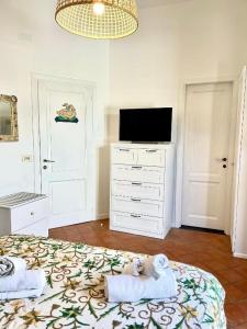 TV a/nebo společenská místnost v ubytování Relais Fontania