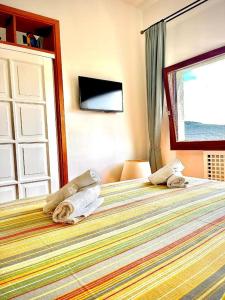 Postel nebo postele na pokoji v ubytování Relais Fontania