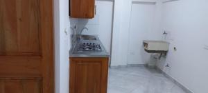 Kuchyň nebo kuchyňský kout v ubytování Apartamentos con estacionamiento cerca al parque