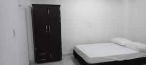 Postel nebo postele na pokoji v ubytování Apartamentos con estacionamiento cerca al parque