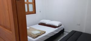 Postel nebo postele na pokoji v ubytování Apartamentos con estacionamiento cerca al parque