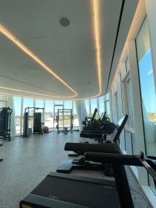 a gym with treadmills and ellipticals in a building at Ayia Napa Marina Exclusive Apartment in Ayia Napa +68 photos