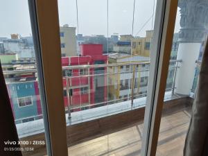 a view of a city from a window at Hotel Global Retreat in Digha