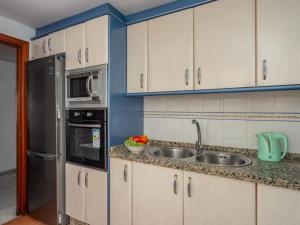a kitchen with a sink and a refrigerator at Apartment Las Terrazas by Interhome in Marbella