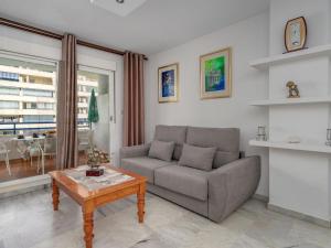 a living room with a couch and a coffee table at Apartment Las Terrazas by Interhome in Marbella