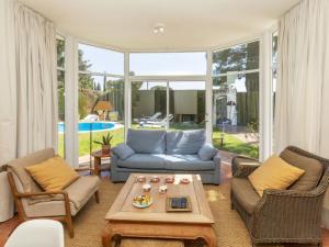 a living room with a couch and chairs and a table at Holiday Home Serge by Interhome in Cambrils