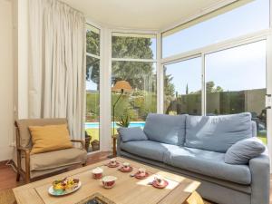 a living room with a couch and a table at Holiday Home Serge by Interhome in Cambrils