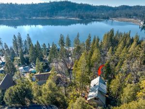 an aerial view of a lake with a house at Lakeview Lodge w/ Boat slip, hot tub, lake views in Bass Lake