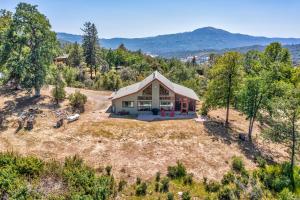 an overhead view of a home with a large yard at Hilltop Haven- Bright and Modern Cabin w/ hot tub and stunning views! in Yosemite Forks