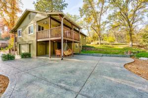 a house with a large driveway in front of it at Yosemite Corner w NEW game room/Hot Tub/EV & more! in Yosemite Forks