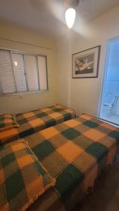 Ένα ή περισσότερα κρεβάτια σε δωμάτιο στο Cobertura da Viviane +15 φωτογραφίες