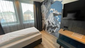 Postel nebo postele na pokoji v ubytování Dom-Hotel