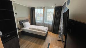 Postel nebo postele na pokoji v ubytování Dom-Hotel