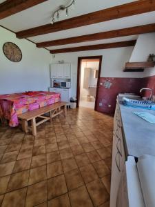 a large living room with a table and a couch at La Mauselaine in Gerbépal