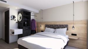Postel nebo postele na pokoji v ubytování Dom-Hotel