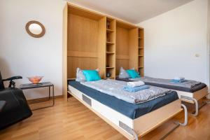Postel nebo postele na pokoji v ubytování Ferienwohnung Adrion