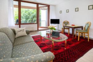 TV a/nebo společenská místnost v ubytování Ferienwohnung Adrion