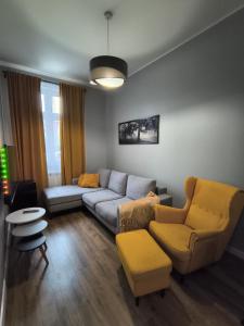 Posezení v ubytování Tabago Studio 32 Brzeg Wolności