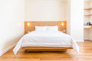 Tempat tidur dalam kamar di Hotel snowlion