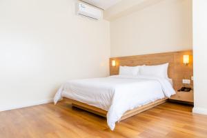Tempat tidur dalam kamar di Hotel snowlion