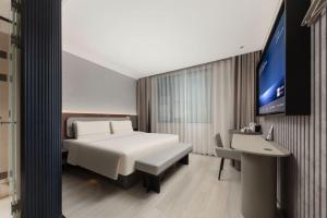 Televisyen dan/atau pusat hiburan di Atour Light Hotel Hangzhou Xiaoshan People's Square