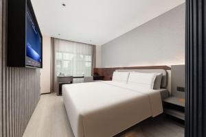 Katil atau katil-katil dalam bilik di Atour Light Hotel Hangzhou Xiaoshan People's Square