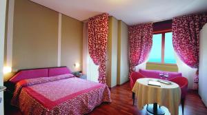 Postel nebo postele na pokoji v ubytování Nouvel Hotel Des Bains