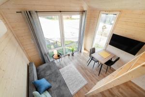 an overhead view of a tiny house with a living room at Domki Stolem in Jastarnia
