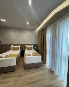 Voodi või voodid majutusasutuse Alko Hotel Bushat toas