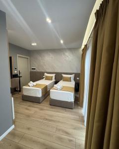 Voodi või voodid majutusasutuse Alko Hotel Bushat toas