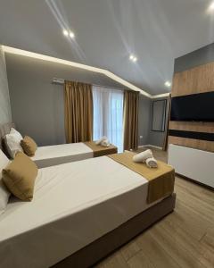 Voodi või voodid majutusasutuse Alko Hotel Bushat toas