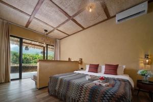 a bedroom with a large bed and a large window at penida in Tianxin