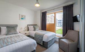 Postel nebo postele na pokoji v ubytování Talbot Suites at Stonebridge