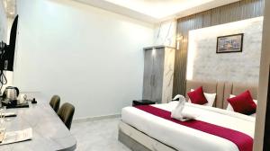 TV a/nebo společenská místnost v ubytování Hotel Shivsudhaa + 24 fotografií