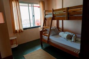 Postel nebo postele na pokoji v ubytování Steinberg Transient Baguio