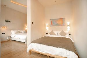 a bedroom with two beds in a room at EUPHORIA丨Quiet Garden Quiet Designer Garden Hotel丨Datang Never Sleeps City Big Wild Goose Pagoda Subway Station Branch丨Near the scenic area in Xi'an